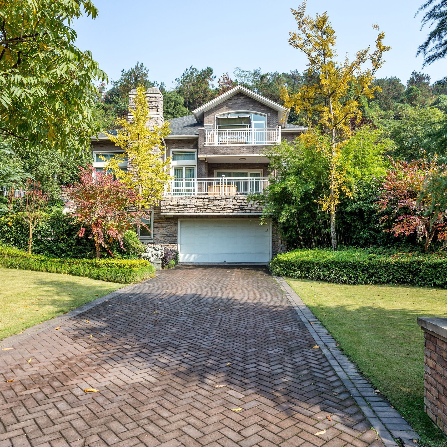 Suburban house with garden and driveway.